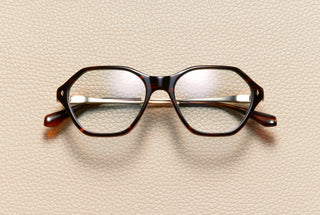 Audrey Fire optical frame by L'Écurie Paris, hexagonal red-brown fire acetate with 18K gold-plated titanium temples, prescription ready