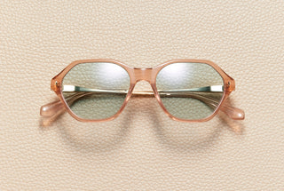 Audrey Blush sunglasses by L'Écurie Paris, hexagonal translucent blush acetate frame with sand lenses and 18K gold-plated titanium temples