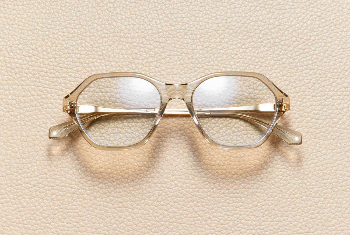 Audrey Nude optical frame by L'Écurie Paris, hexagonal translucent nude acetate with 18K gold-plated titanium temples, prescription ready