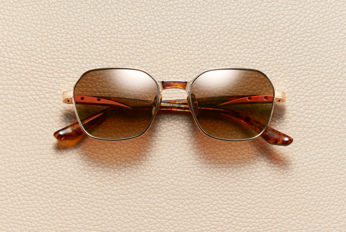 Gabriel Blonde Tortoise sunglasses by L'Écurie Paris, geometric 18K gold-plated titanium frame with blonde tortoise acetate and golden summer gradient lenses