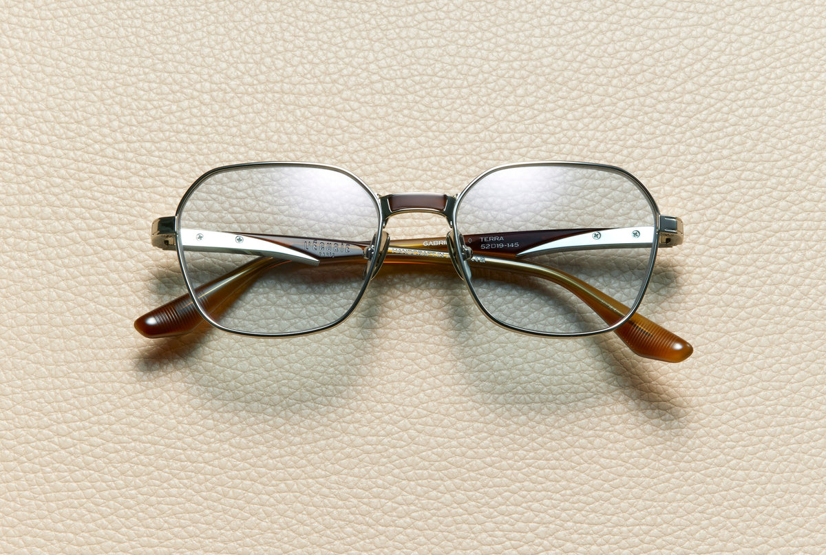 Gabriel Terra sunglasses by L'Écurie Paris, geometric 14K white gold-plated titanium frame with terra acetate and dusty blue lenses