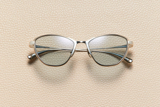 Mia cat-eye sunglasses in 14K white gold plated titanium with dusty blue lenses by L'Écurie Paris