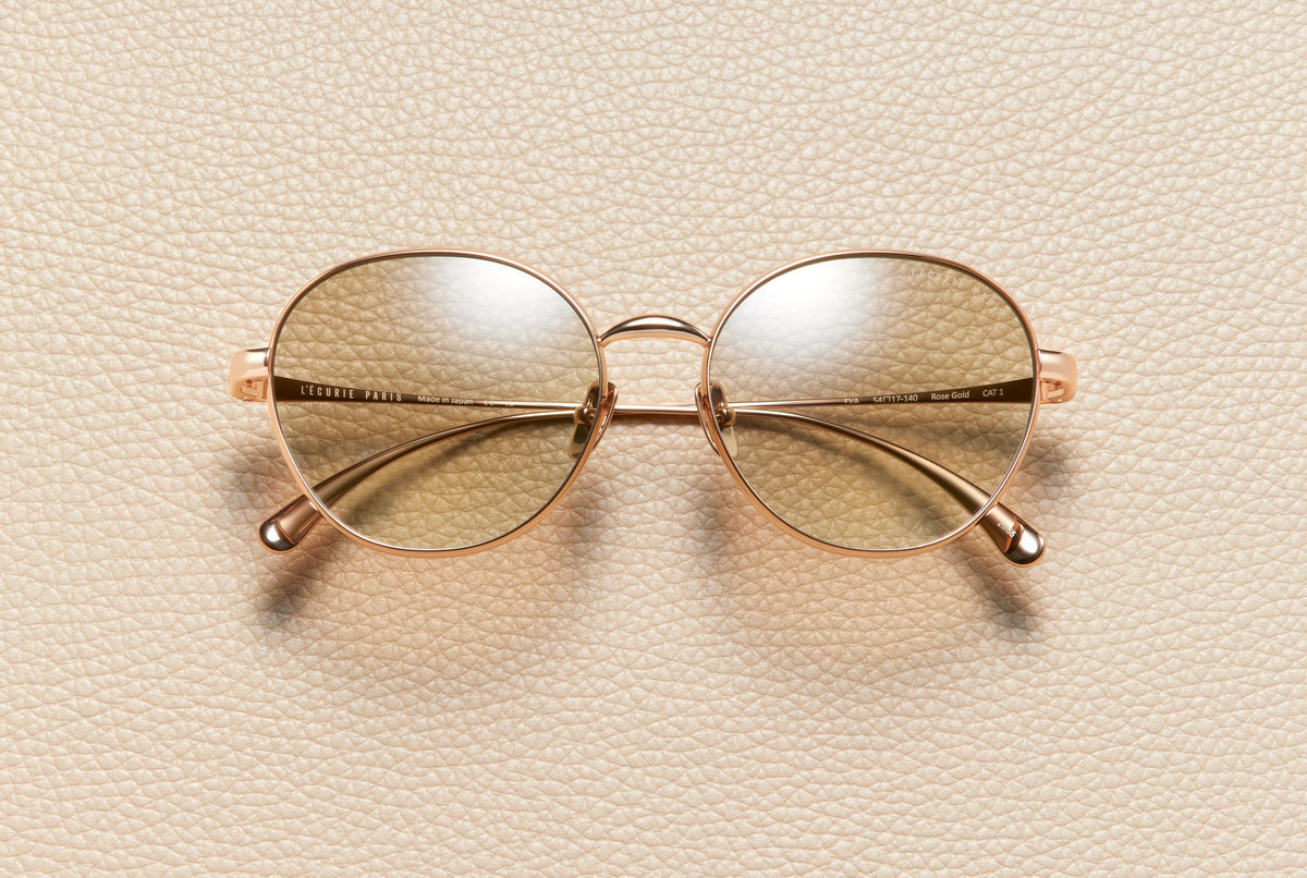 Eva round sunglasses in 18K rose gold plated titanium with baby brown gradient lenses by L'Écurie Paris
