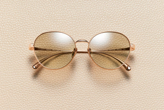 Eva round sunglasses in 18K rose gold plated titanium with baby brown gradient lenses by L'Écurie Paris