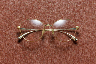 Eva round optical frame in 18K gold plated titanium by L'Écurie Paris