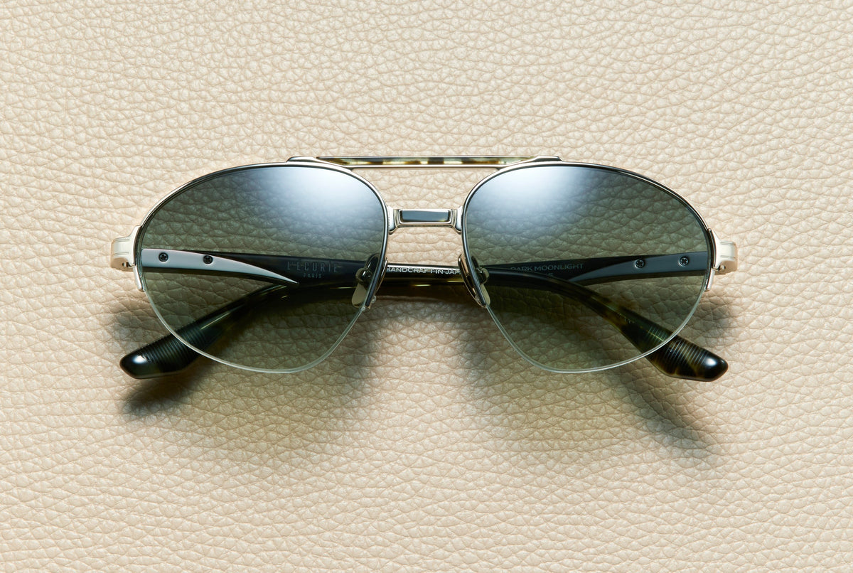 John Dark Moonlight aviator sunglasses by L'Écurie Paris in 14K white gold-plated titanium and dark moonlight acetate with sage silver gradient lenses