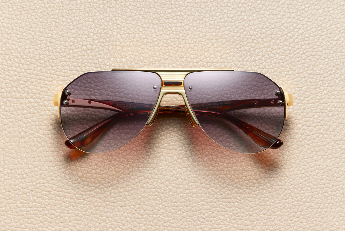James Dark Honey rimless aviator sunglasses by L'Écurie Paris in 24K gold-plated titanium and dark honey acetate with ruby brown gradient lenses