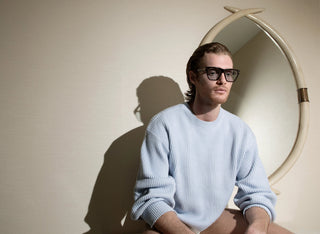 John VanBeber in a blue knit wearing L'Ecurie Paris optical frames, Fashion For Men editorial