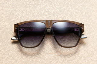 L'Écurie Paris George Grey translucent acetate sunglasses on cream leather
