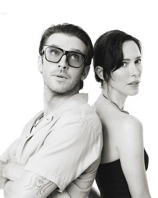 Dan Stevens in L'Écurie Paris Victor Black sunglasses with Rebecca Hall, EW photo studio at Comic-Con 2026